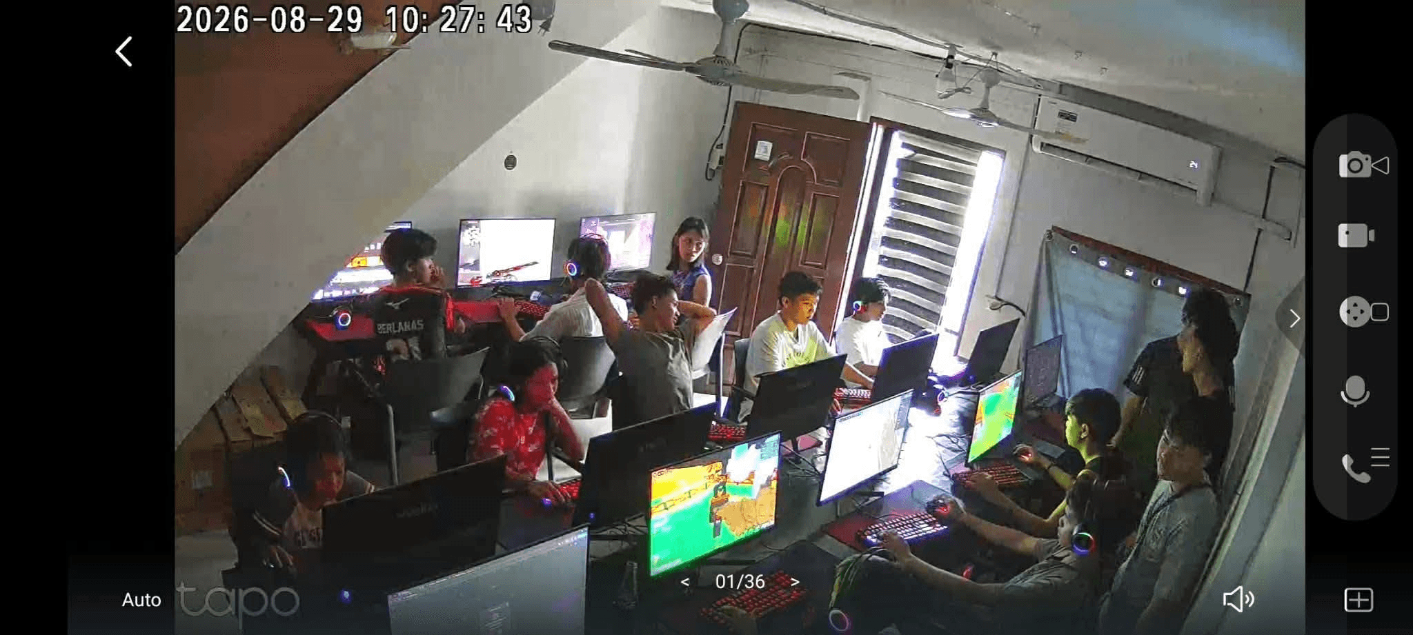 Security camera view of active internet cafe PCs managed by CafeCentro